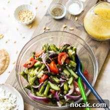 Overhead photo of glass bowl filled with grilled asparagus salad