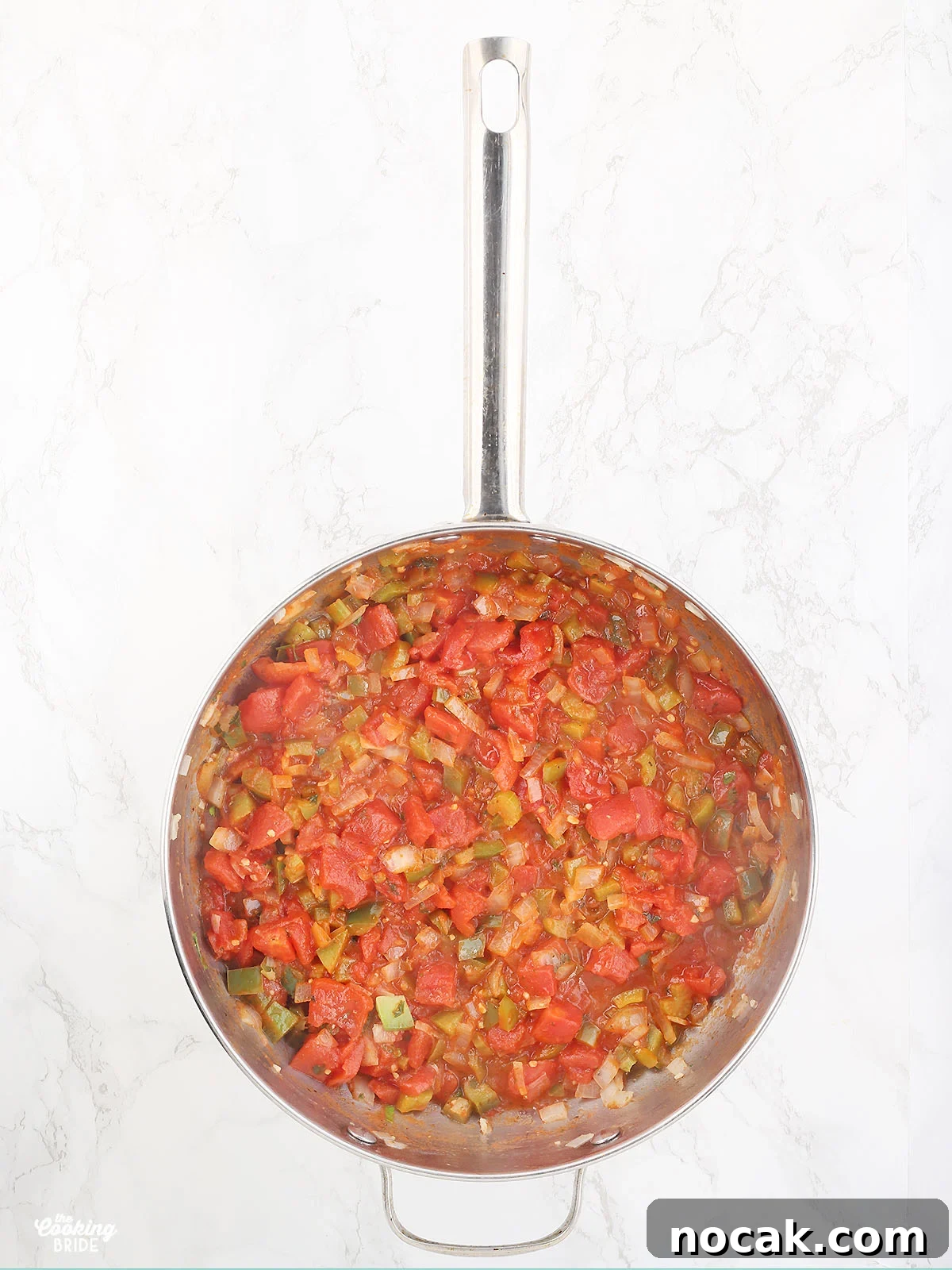 Authentic Louisiana Shrimp Creole Recipe — Classic Creole Flavor 5 cooked vegetables and dice tomatoes in a stainless steel pan