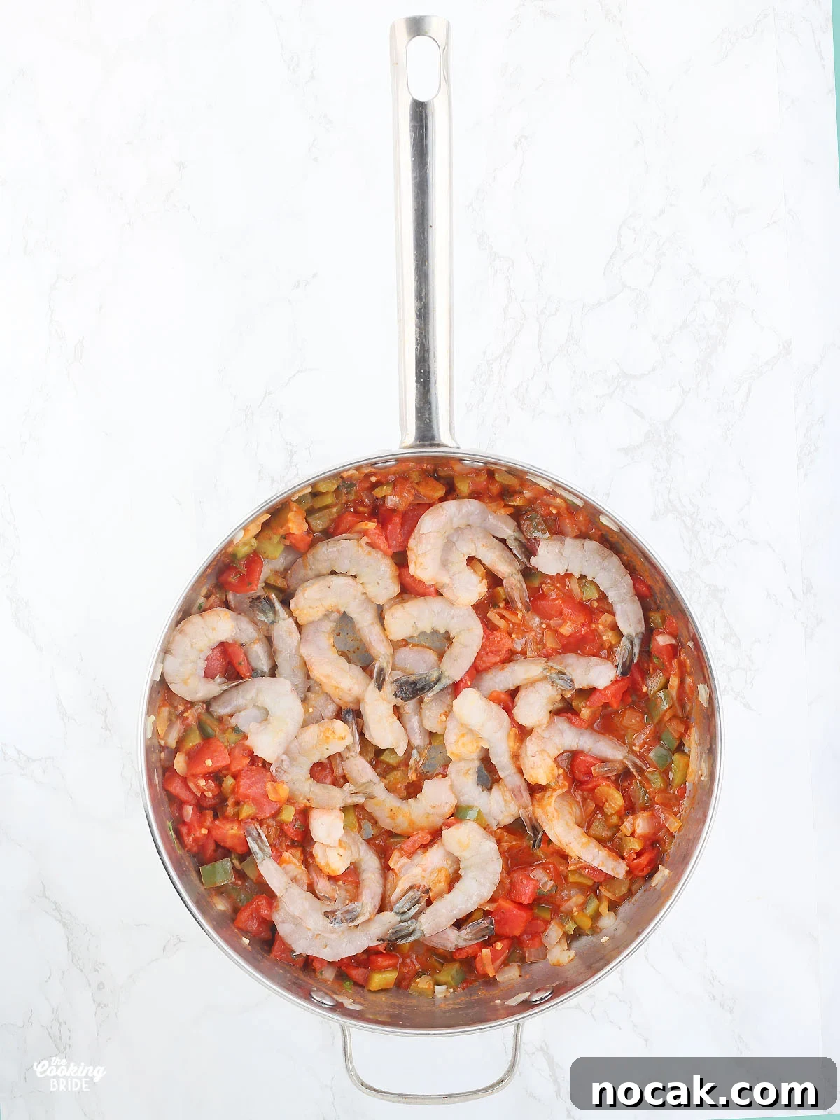 Authentic Louisiana Shrimp Creole Recipe — Classic Creole Flavor 6 adding the raw shrimp to the pan with tomatoes and vegetables