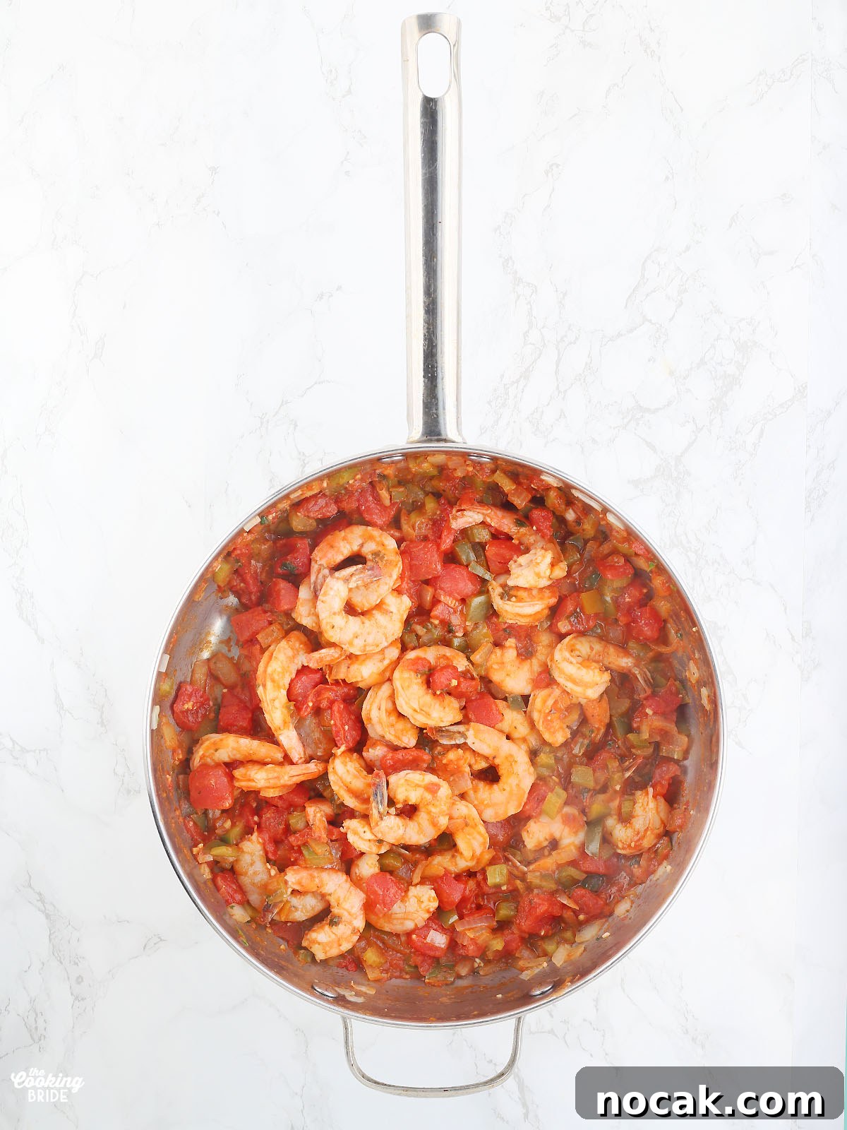 Authentic Louisiana Shrimp Creole Recipe — Classic Creole Flavor 7 cooked shrimp creole in a stainless steel pan