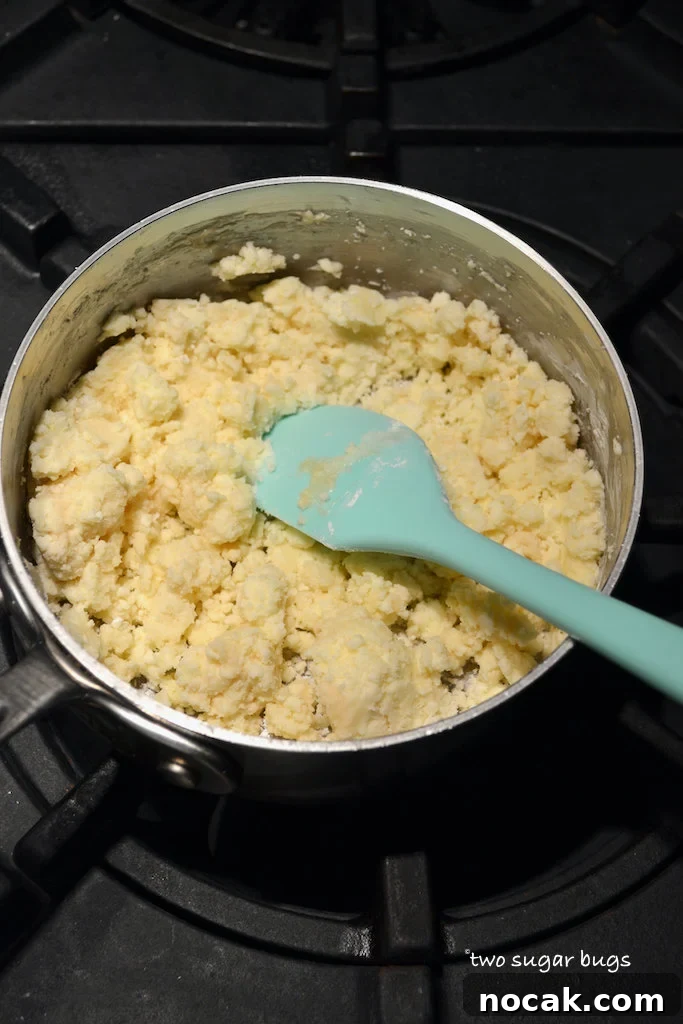 white chocolate topping in a saucepan on the stove