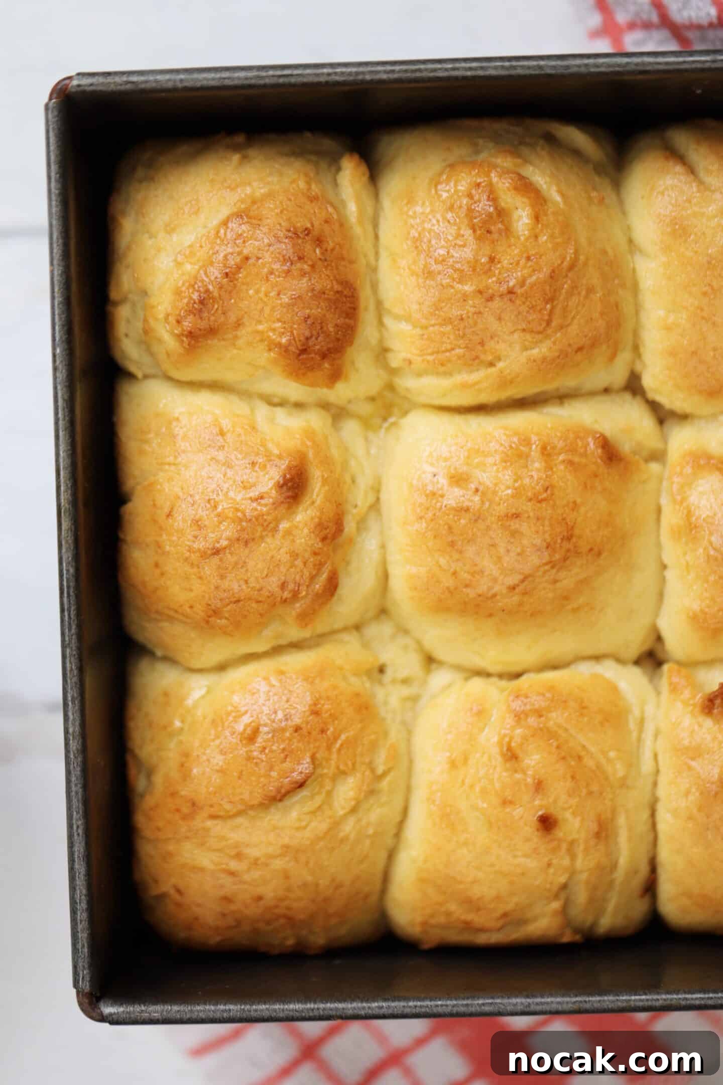 Gluten-Free Hawaiian Rolls Recipe: Soft, Sweet, and Vegan Option 12 Gluten free Hawaiian rolls in a baking tin.