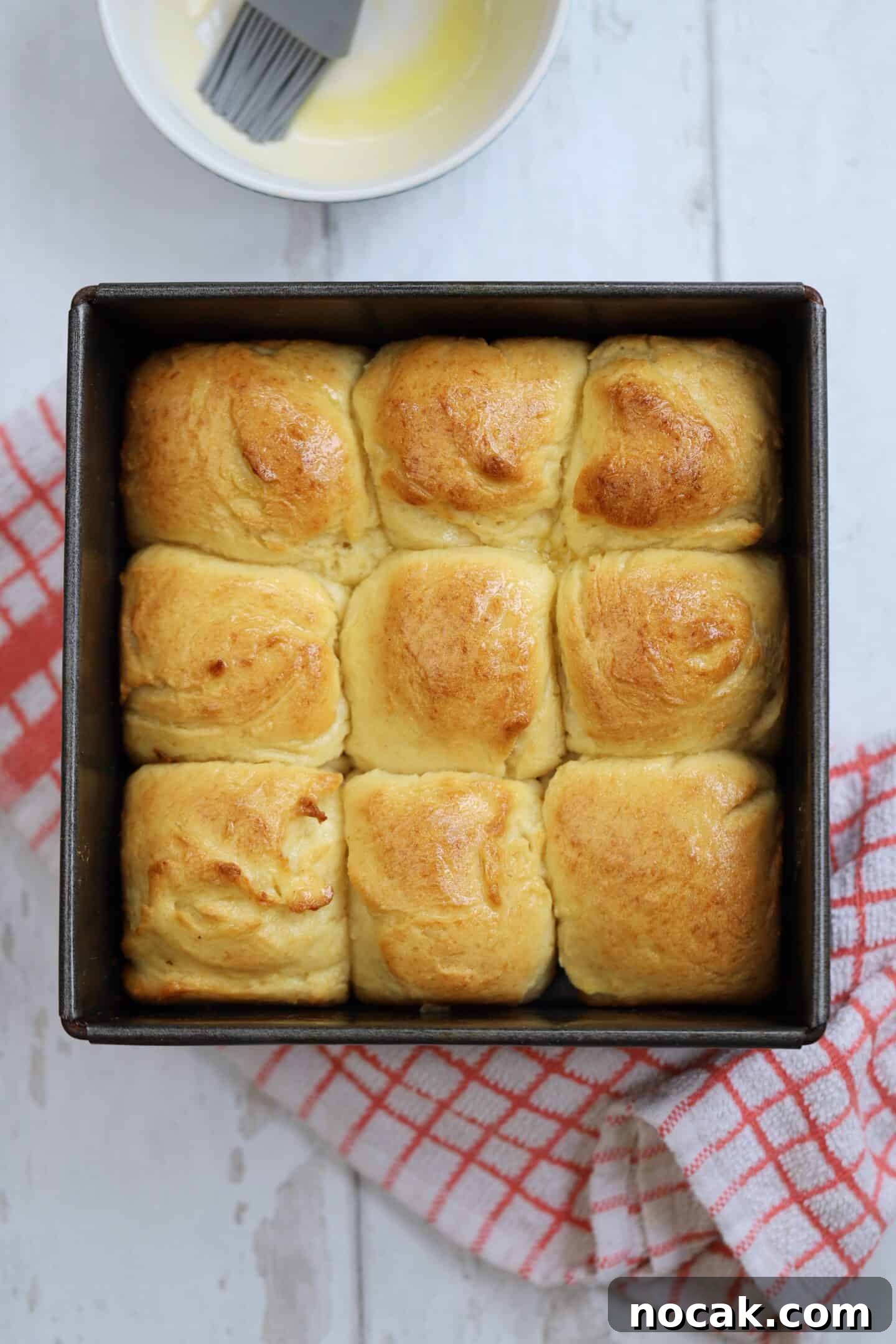 Gluten-Free Hawaiian Rolls Recipe: Soft, Sweet, and Vegan Option 3 Gluten free Hawaiian rolls in a baking tin.