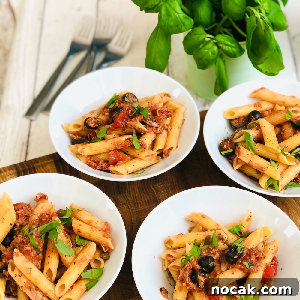 One-Pot Orzo Bolognese Recipe for Flavorful Weeknight Dinners 6 tuna bolognese drizzled with olive oil and topped with torn basil leaves served in bowls