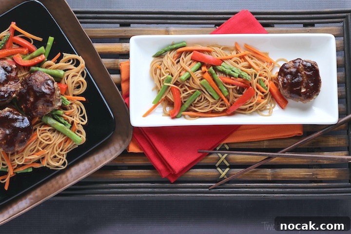 Delicious family-favorite mini meatloaf recipe! Served over Asian noodles and vegetables! These meatloaf 'muffins' bake fast for busy weeknight dinners! Hoisin-Glazed Mini Meatloaf 'Muffins' Over Asian Noodles and Vegetables