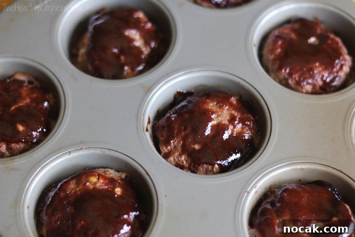 Hoisin-Glazed Mini Meatloaf Muffins Over Asian Noodles & Veggies 8 Mini meatloaf muffins served with noodles and veggies