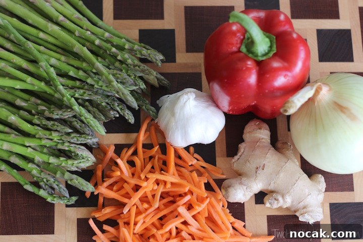 Hoisin-Glazed Mini Meatloaf Muffins Over Asian Noodles & Veggies 2 Matchstick carrots and prepared veggies for quick prep
