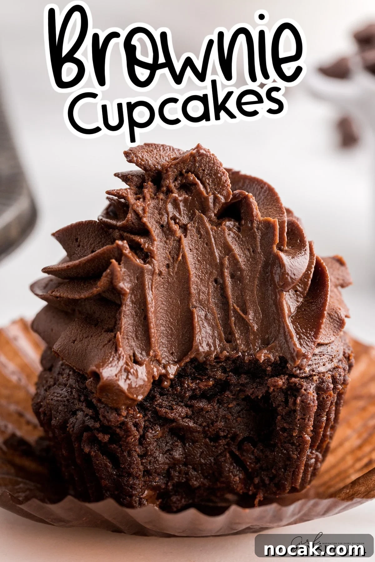 Fudgy Brownie Cupcakes with Gooey Chocolate Centers 2 Close up of a Brownie Cupcake with a large bite out of it showing the insides and frosting, with text overlay.