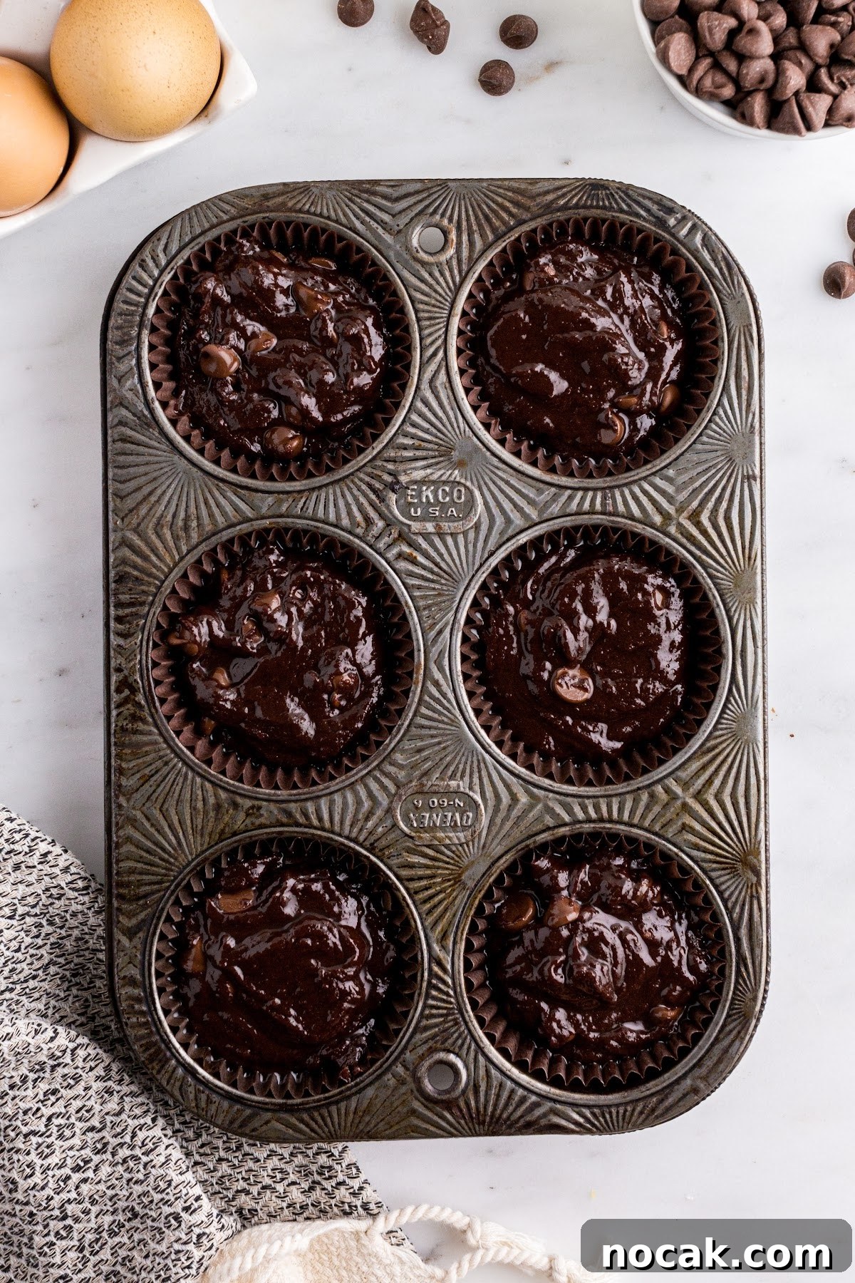 Fudgy Brownie Cupcakes with Gooey Chocolate Centers 8 Poured the batter into cupcake tins.