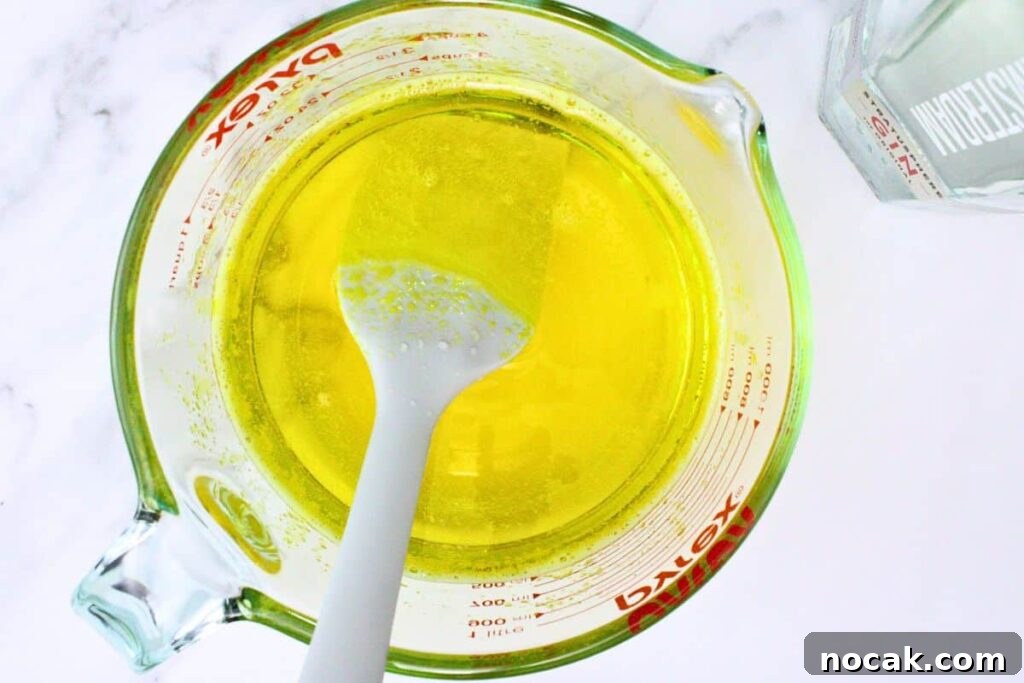 French 75 Jello Shots for a Sparkling New Year’s Party 6 pour in gin and remaining champagne into lemon jello mixture