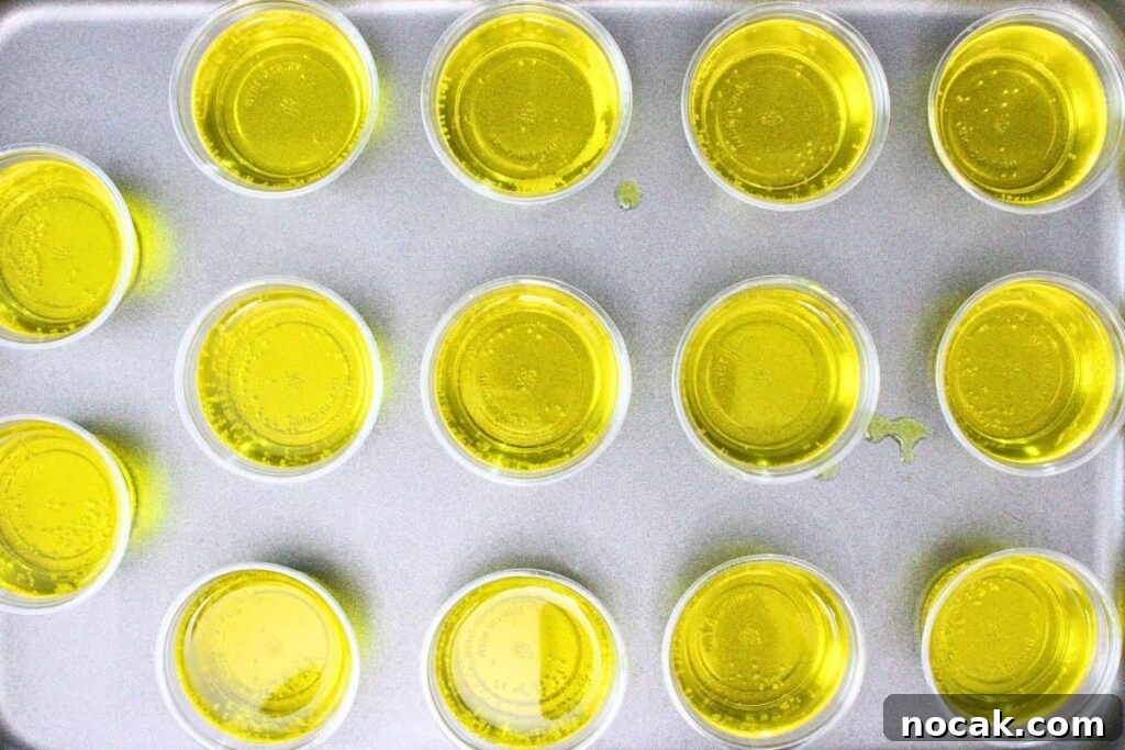 French 75 Jello Shots for a Sparkling New Year’s Party 7 ladle french 75 jello shots into cups