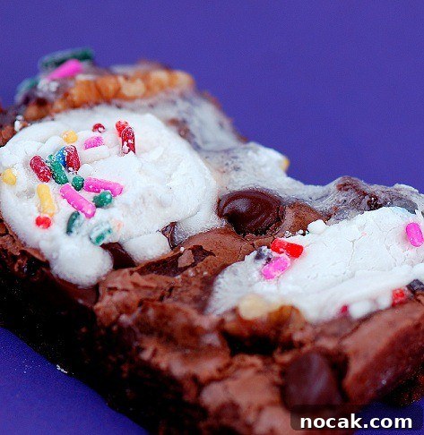 funfetti rocky road brownies cut and served on a plate.