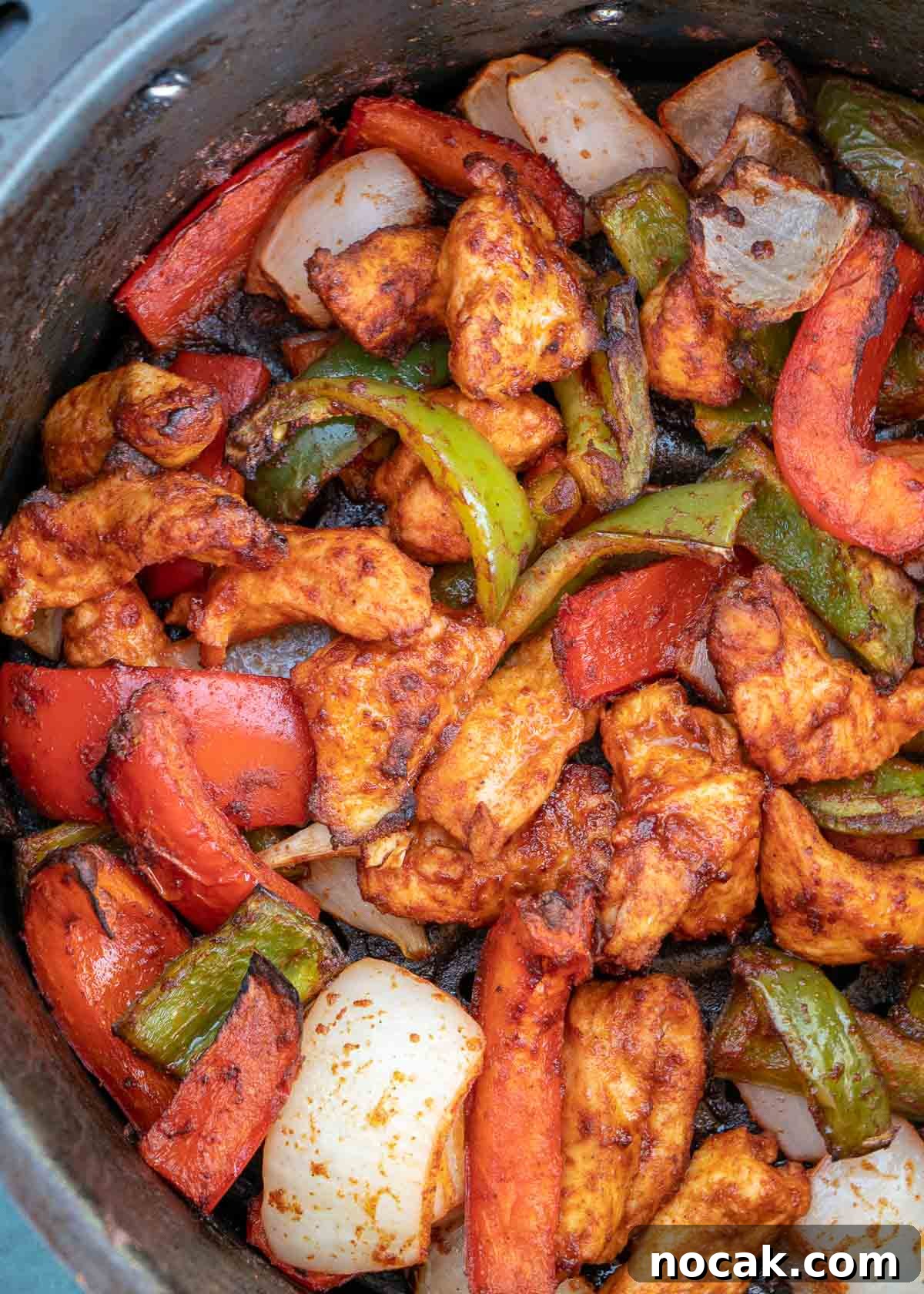 Crispy Air Fryer Chicken Fajitas with Peppers and Onions 2 chicken, bell peppers, onions in air fryer