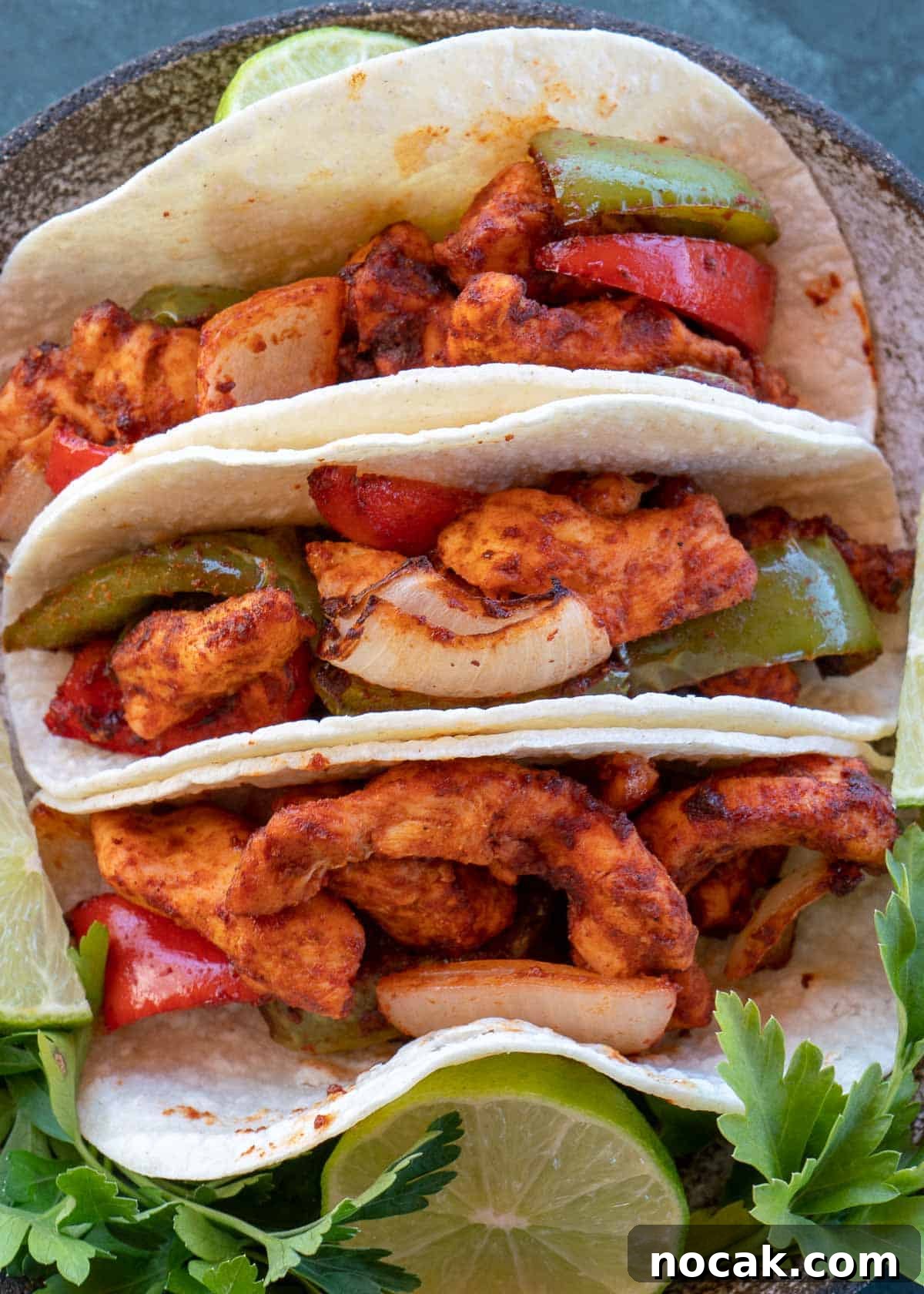 Crispy Air Fryer Chicken Fajitas with Peppers and Onions 12 chicken fajitas on plate