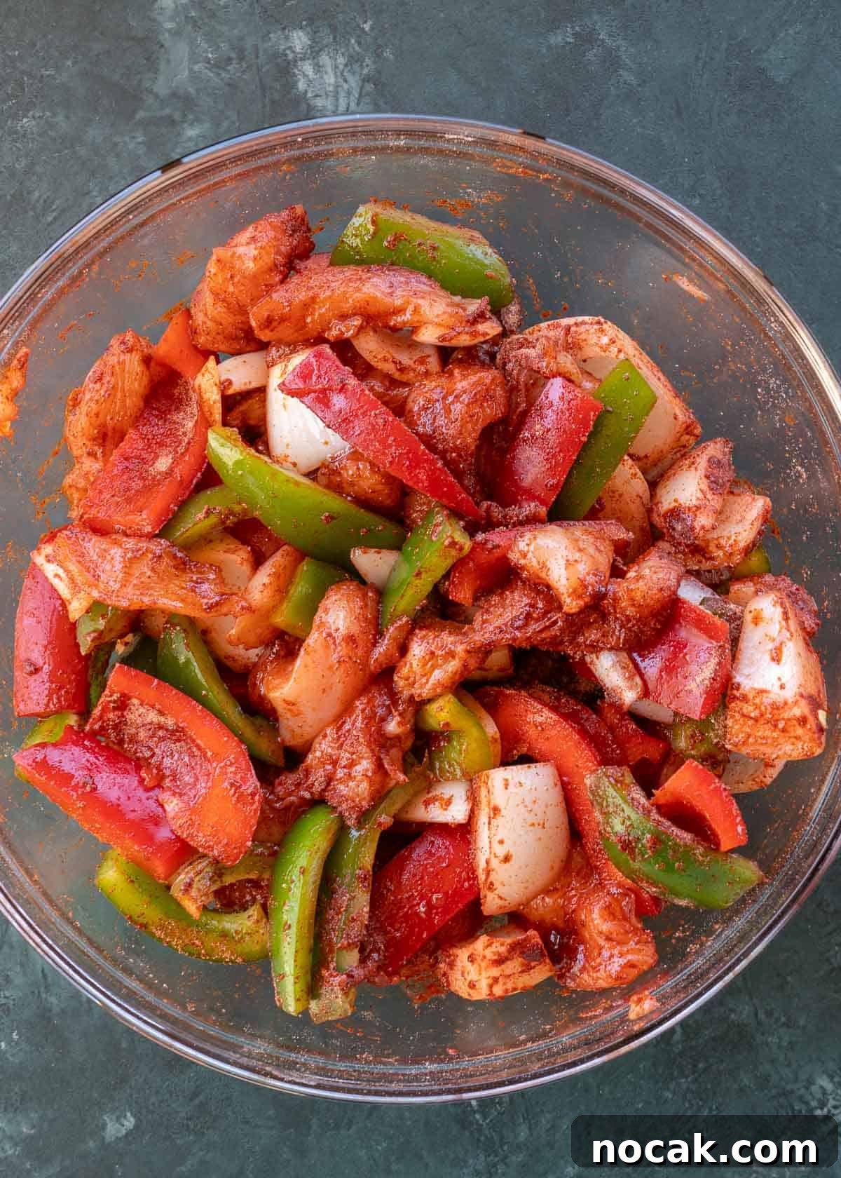 Crispy Air Fryer Chicken Fajitas with Peppers and Onions 7 seasoned fajita mix in bowl