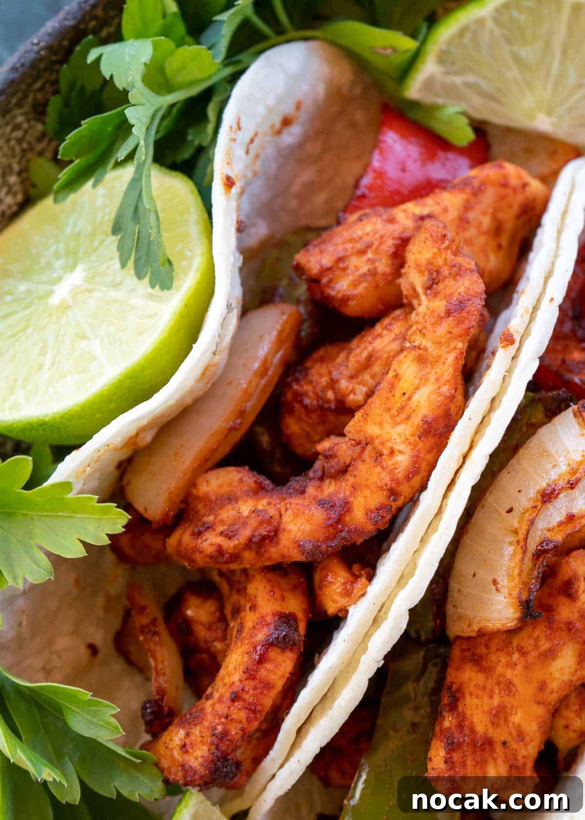 Crispy Air Fryer Chicken Fajitas with Peppers and Onions 10 Chicken Fajitas on plate with lime