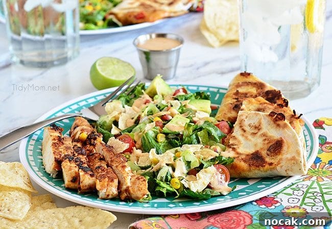Southwest Chicken Quesadilla Salad is like an explosion in your mouth. Super easy to throw together.