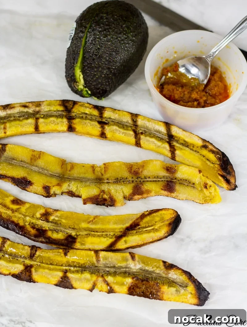 Grilling Plantains: A Simple Guide to Perfect Char and Flavor 2 Halved plantains with grill marks.