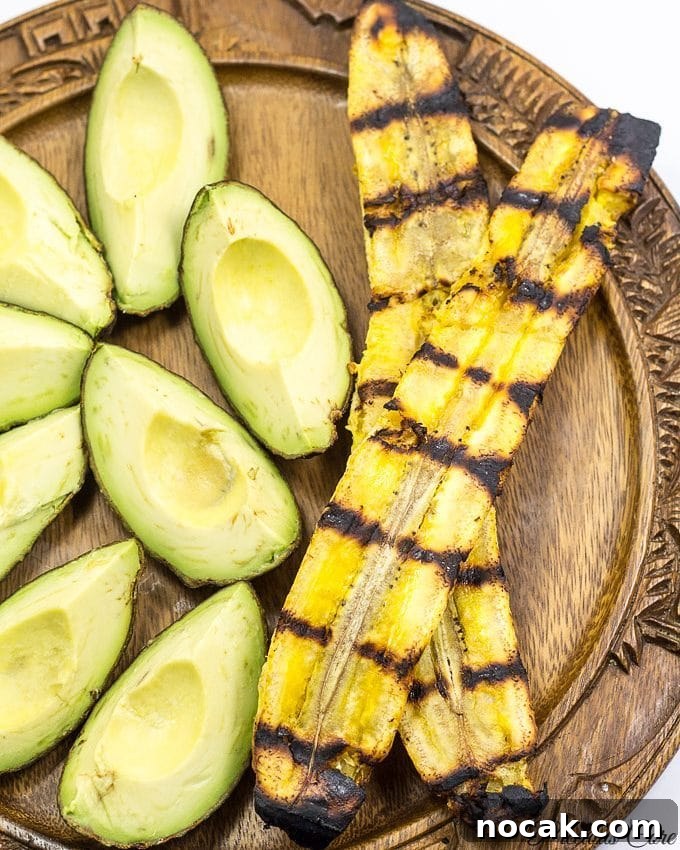 Grilling Plantains: A Simple Guide to Perfect Char and Flavor 3 Plate with grilled plantains and avocado wedges.