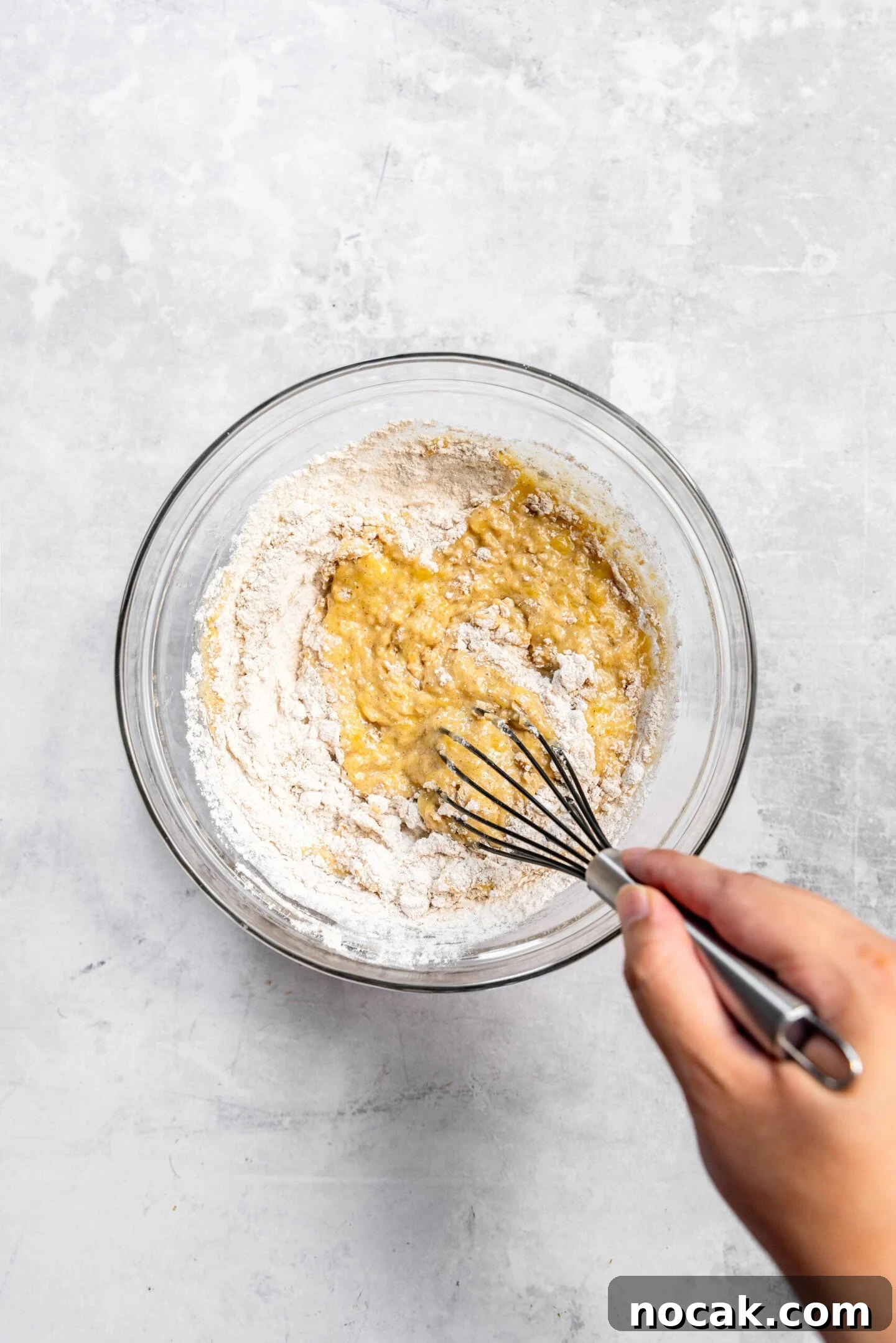 Dry ingredients being whisked into the wet ingredients