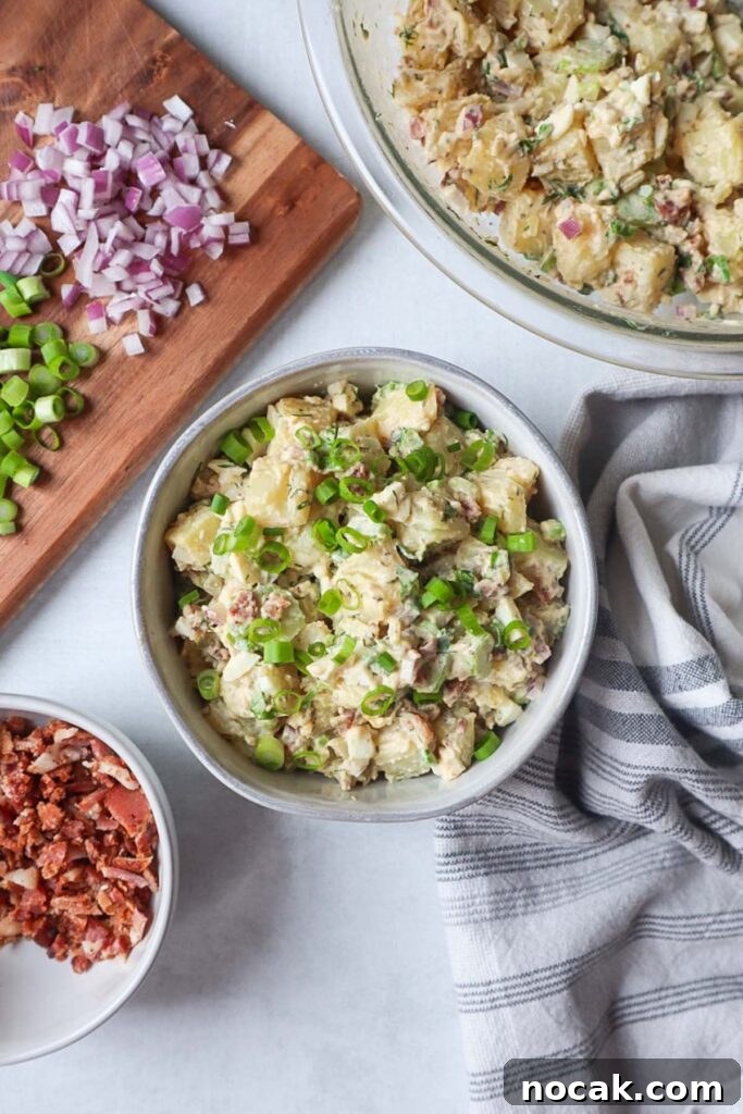 Creamy Potato Salad with Spring Onions and Tangy Dressing 3 bowl with potato salad topped with spring onions