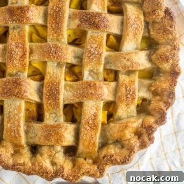 overhead shot of peach mango pie with lattice top crust