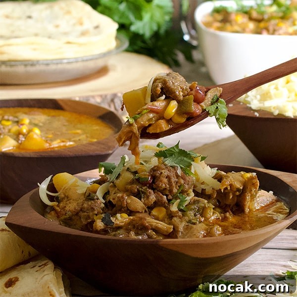 Creamy Chicken and Chorizo Chili with Roasted Corn 3 Taking a bite of creamy chicken chili with roasted corn and chorizo