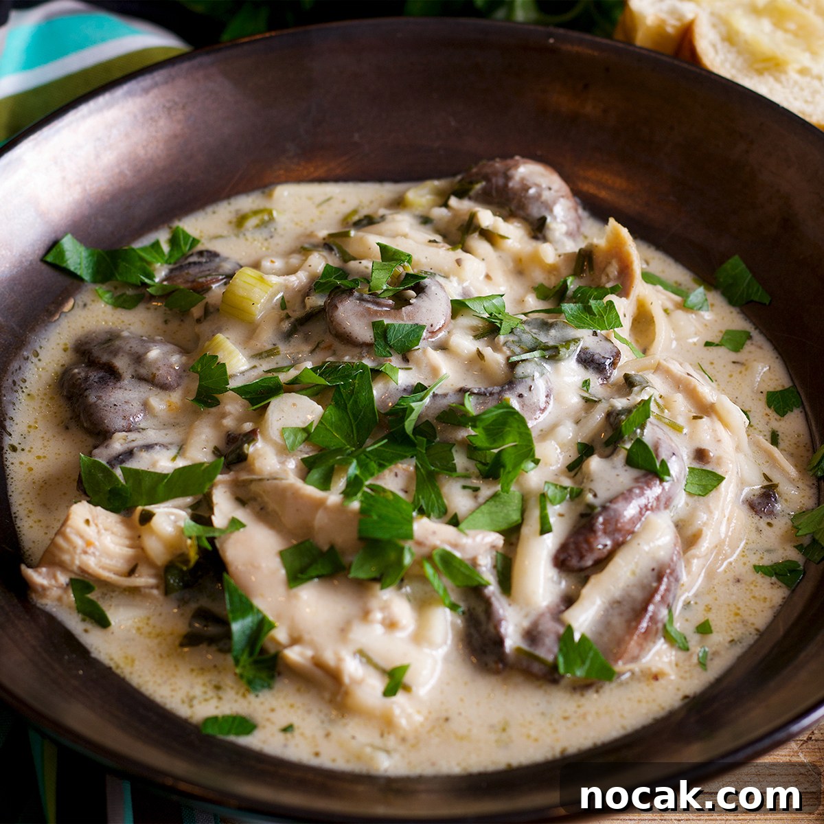A bowl of creamy chicken and mushroom soup.