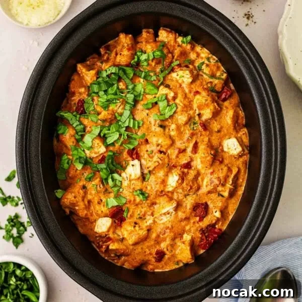 Marry Me Chicken and Rice — One-Pan Dump and Bake Recipe 12 Slow Cooker Marry Me Chicken in a slow cooker pan without the lid on, ready to be served.