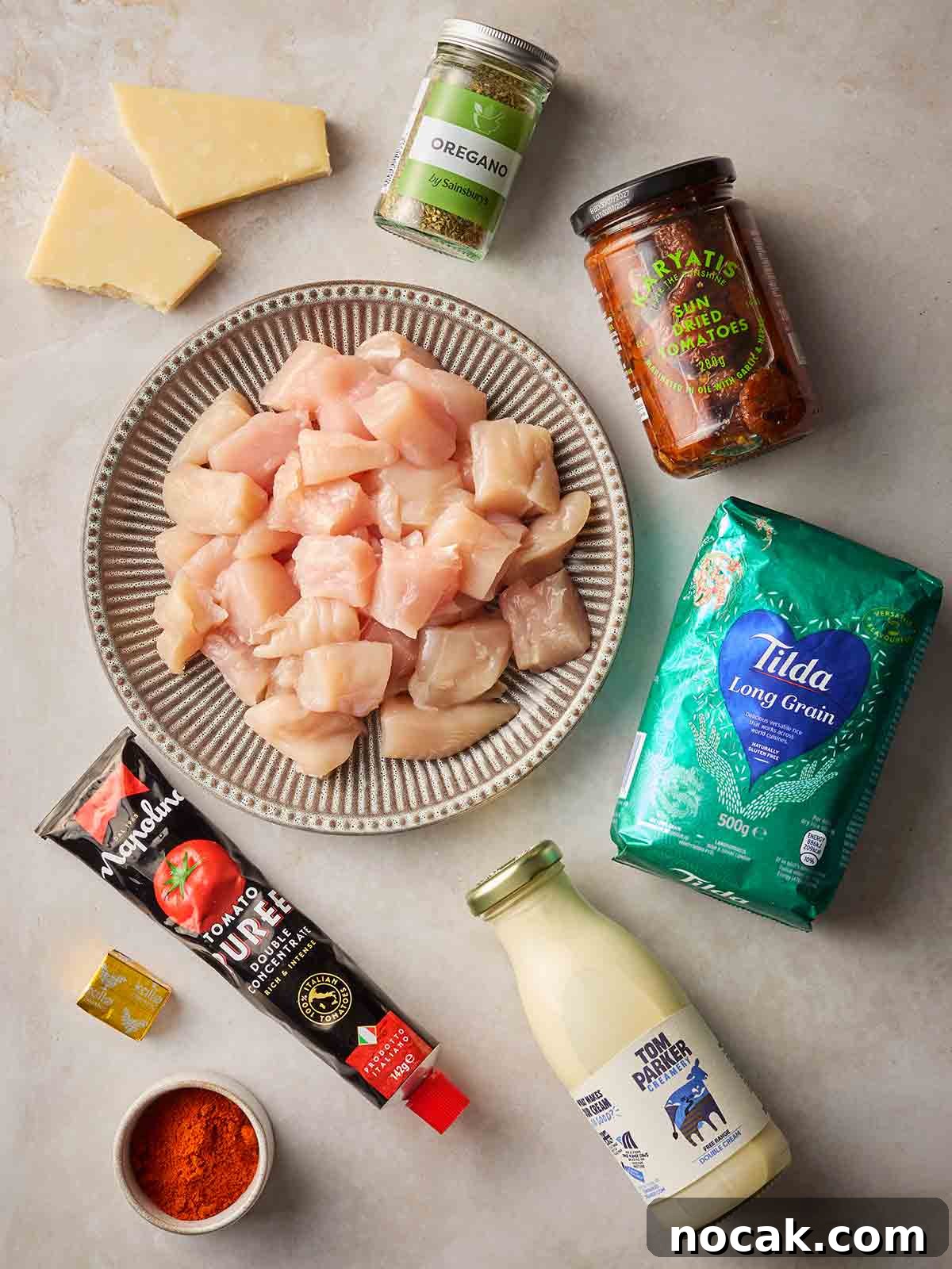 Marry Me Chicken and Rice — One-Pan Dump and Bake Recipe 4 The ingredients of for making an easy chicken and rice dinner laid out on a table.