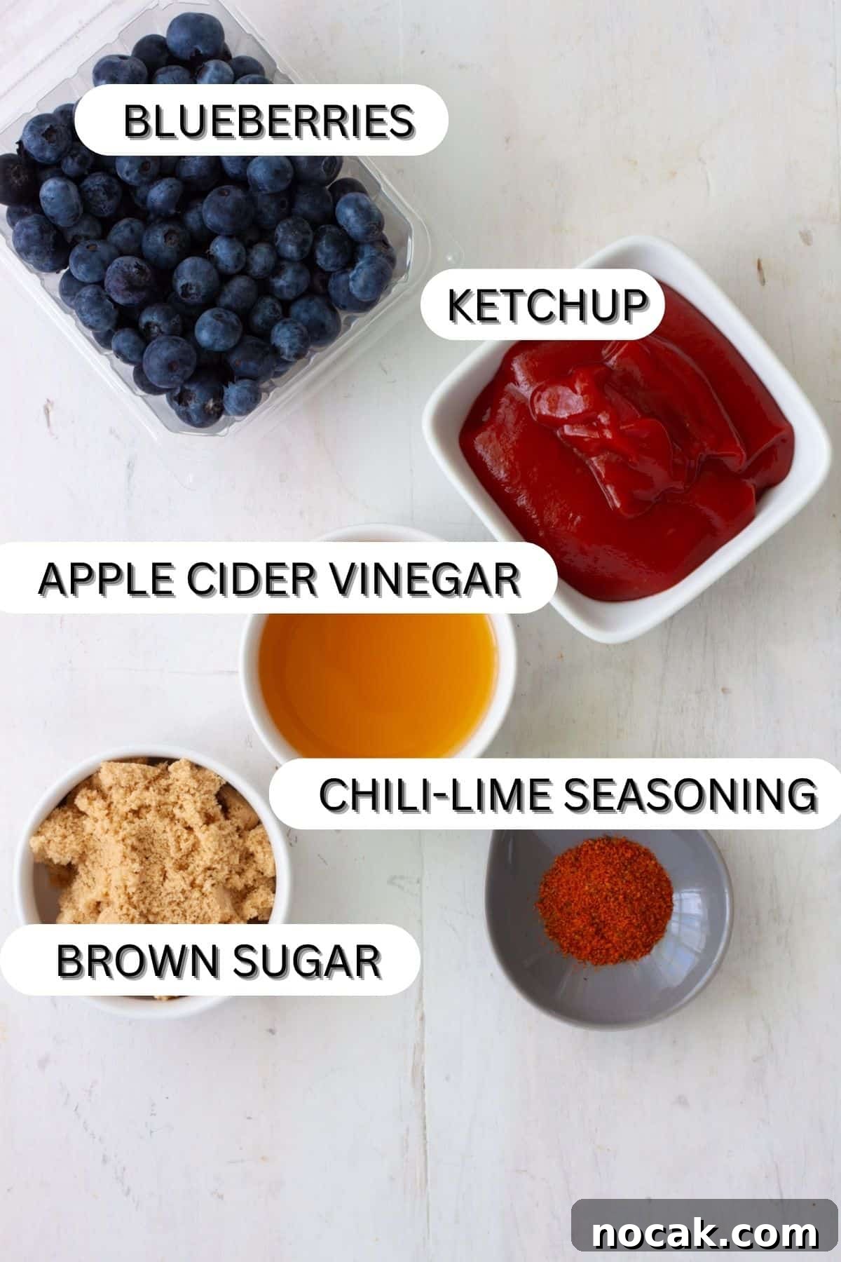 Ingredients for blueberry bbq sauce on a white table.