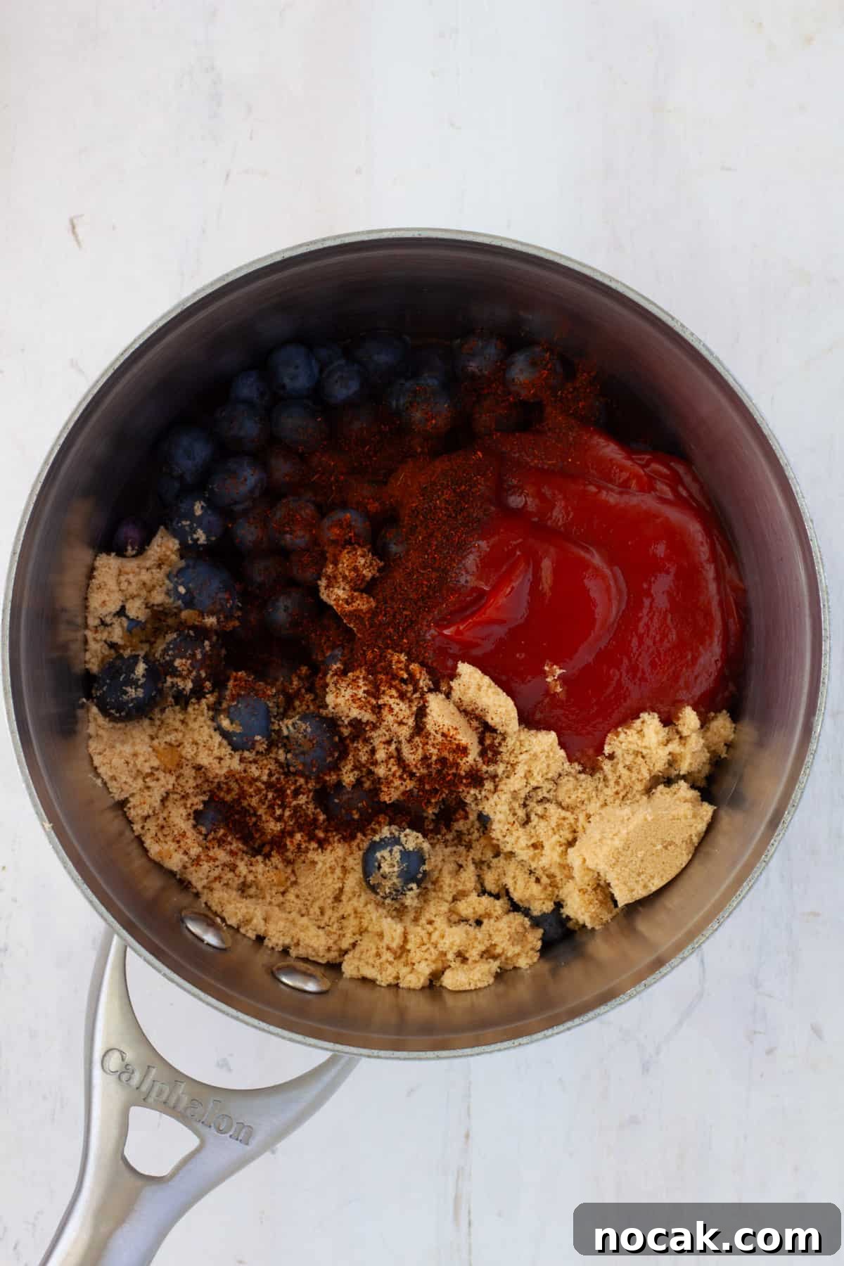 Ingredients for blueberry bbq sauce in a medium saucepan.