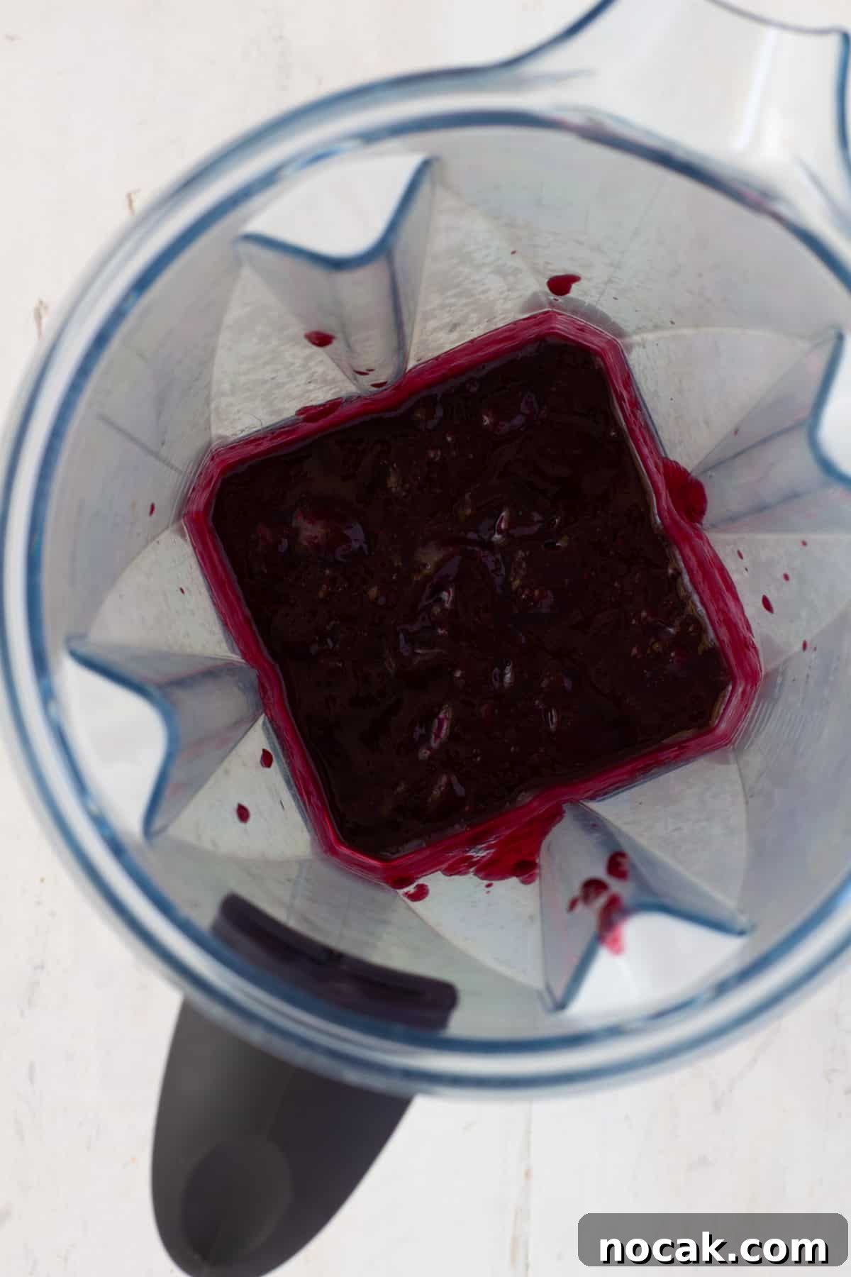 Blueberry BBQ sauce getting pureed in a blender.