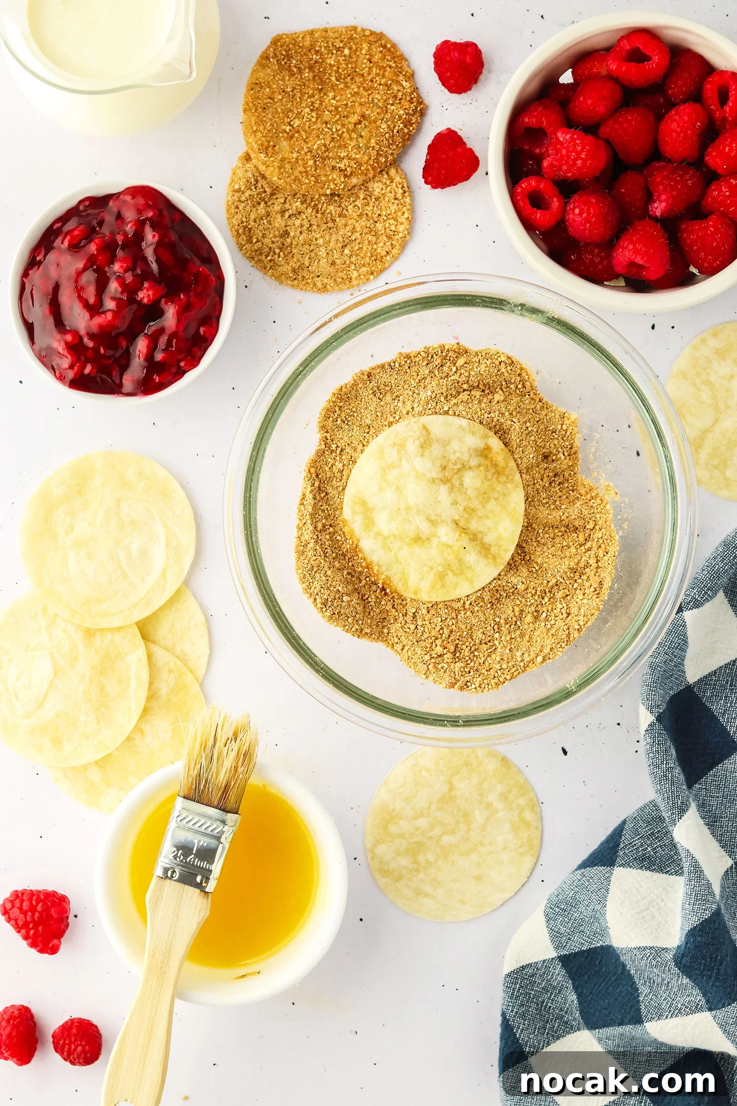 Raspberry Cheesecake Tacos: Creamy Dessert Taco Recipe 6 bowl of graham cracker and cinnamon mixture with a small bowl of melted butter and a basting brush