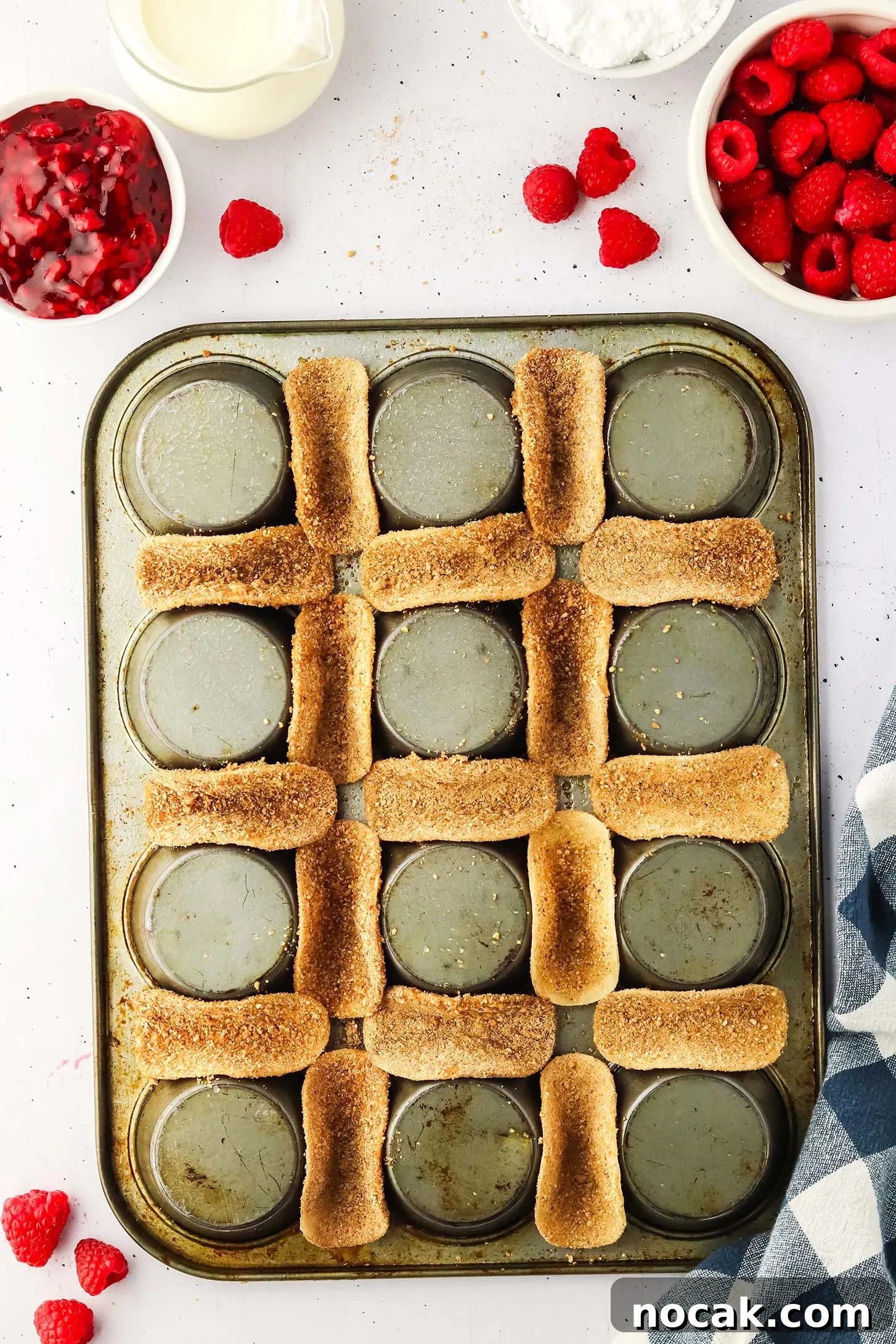 Raspberry Cheesecake Tacos: Creamy Dessert Taco Recipe 7 mini taco shells coated in sweet mixture placed in between upside muffin tin