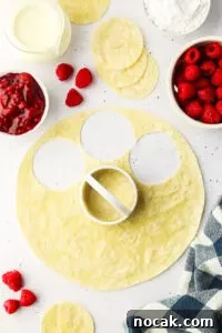 Raspberry Cheesecake Tacos: Creamy Dessert Taco Recipe 13 flour tortilla with circles cut out of it using a cookie cutter