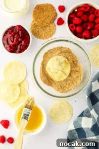 Raspberry Cheesecake Tacos: Creamy Dessert Taco Recipe 15 bowl of graham cracker and cinnamon mixture with a small bowl of melted butter and a basting brush