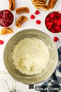 Raspberry Cheesecake Tacos: Creamy Dessert Taco Recipe 18 whisked cheesecake mixture in a stand mixer bowl