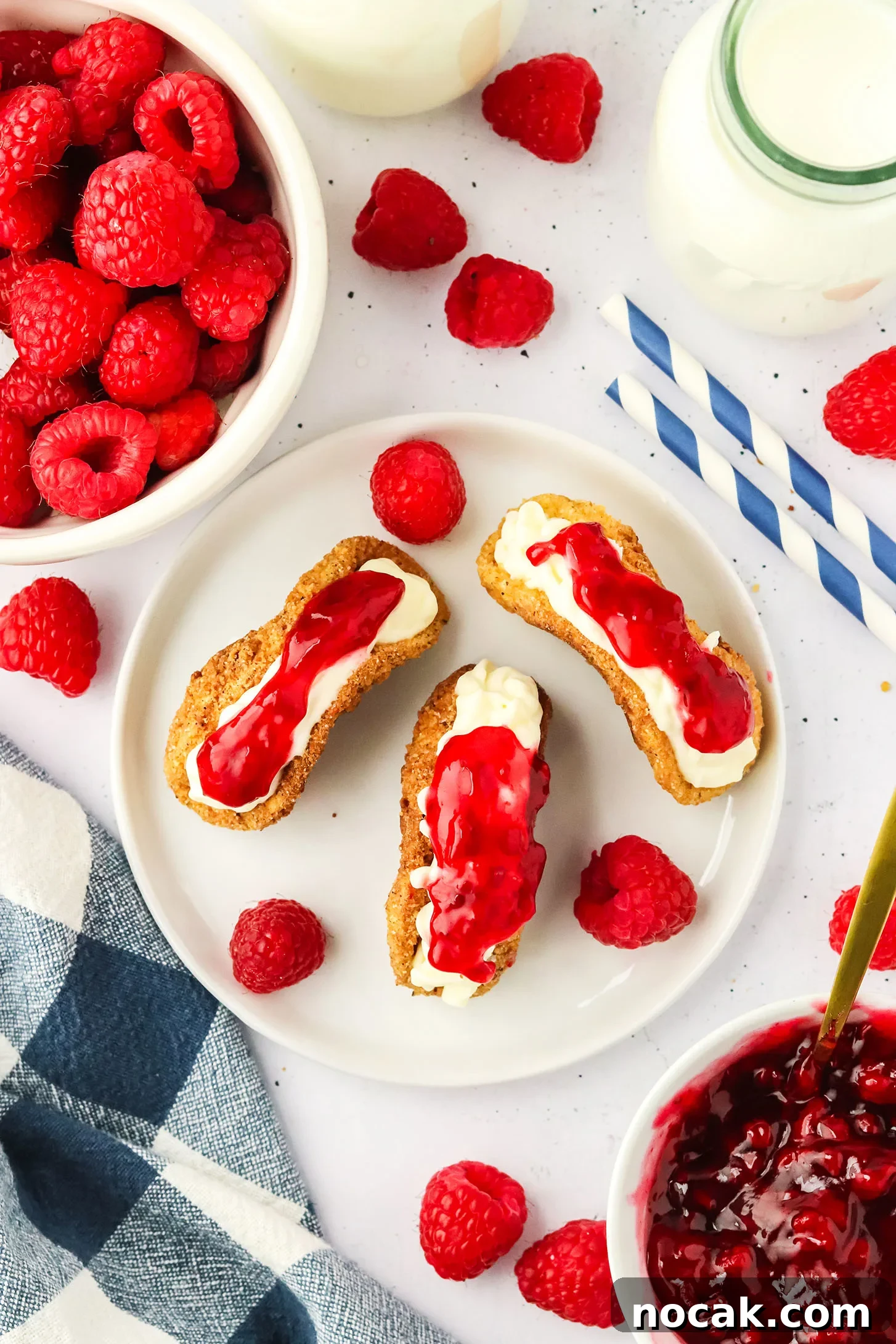 Raspberry Cheesecake Tacos: Creamy Dessert Taco Recipe 3 3 raspberry cheesecake tacos on a white plate