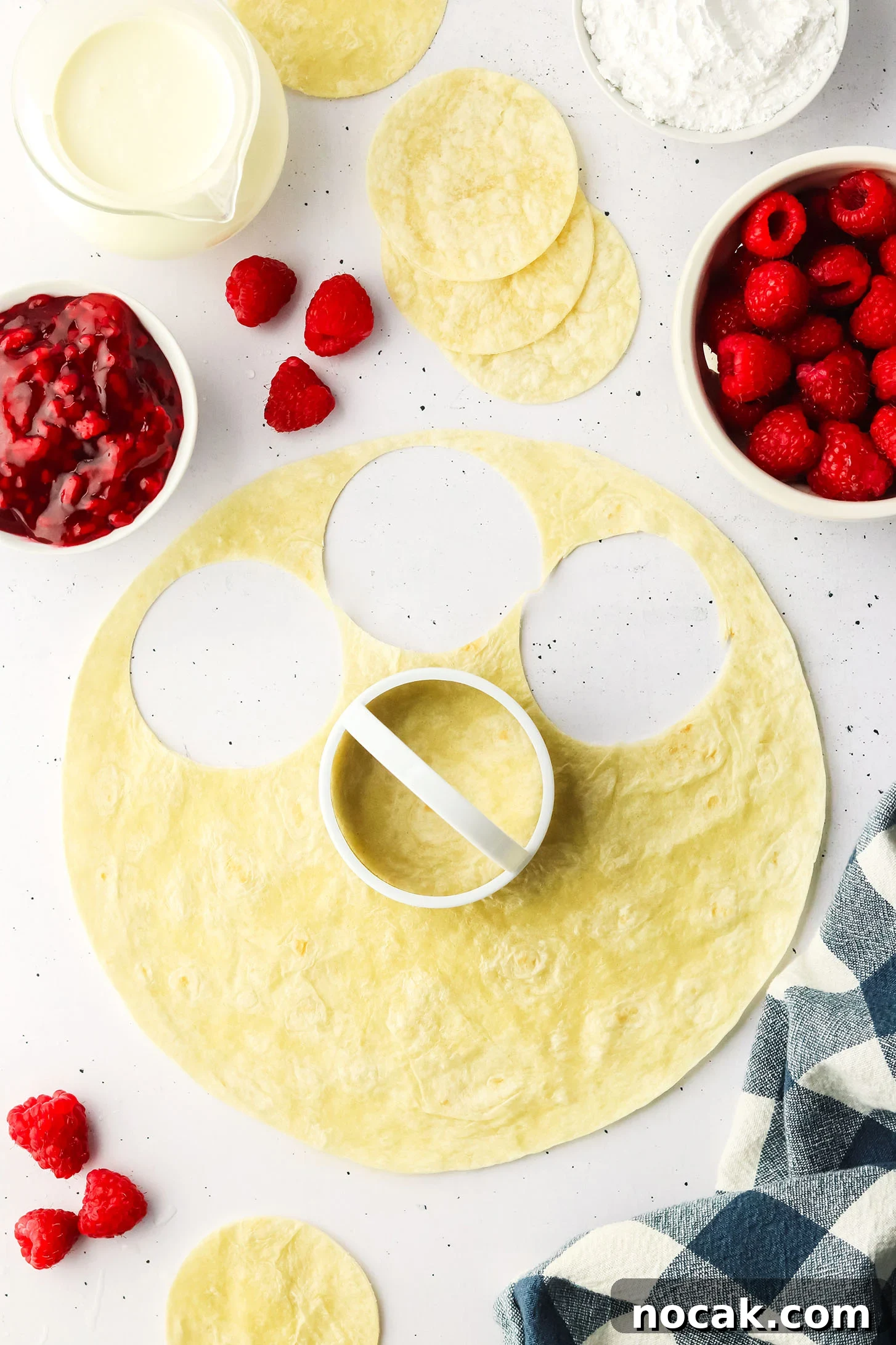Raspberry Cheesecake Tacos: Creamy Dessert Taco Recipe 5 flour tortilla with circles cut out of it using a cookie cutter