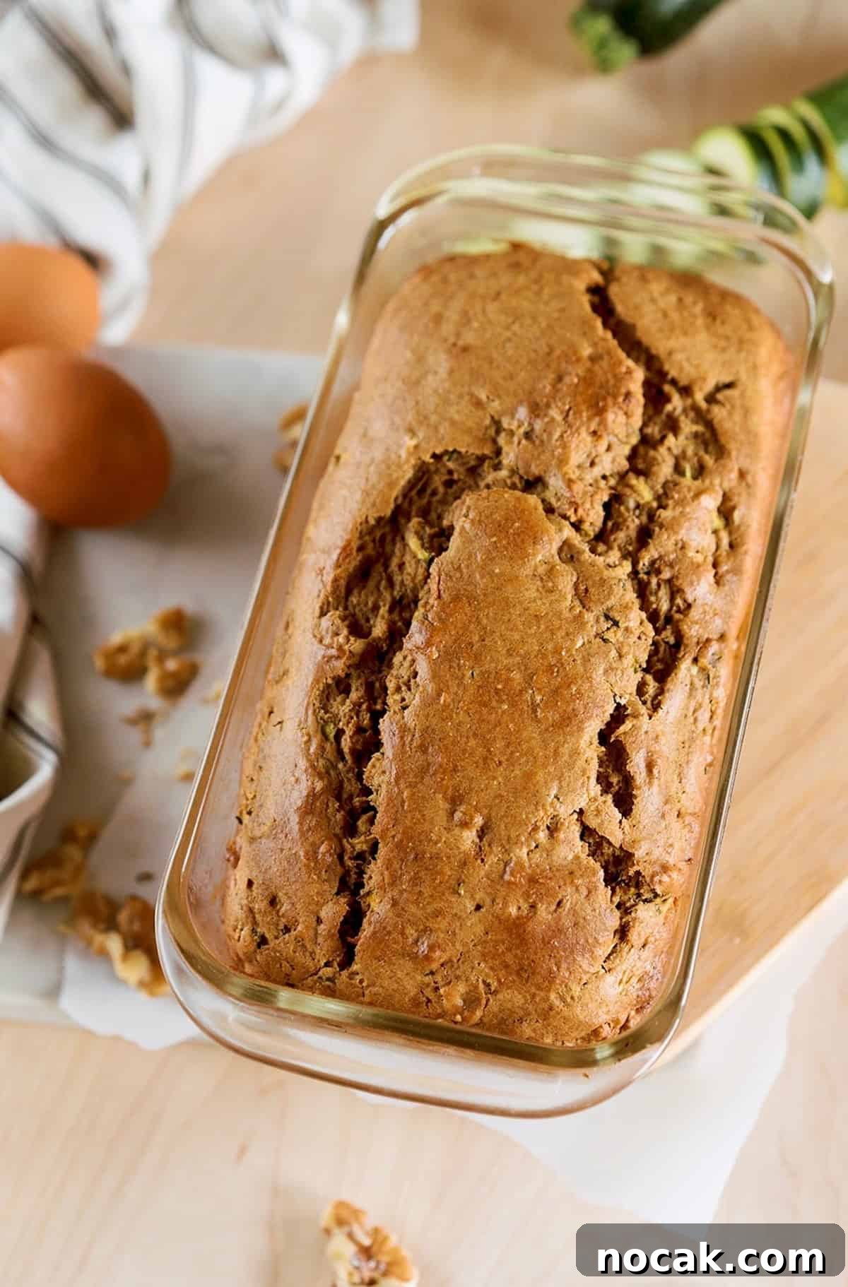 Moist Zucchini Bread with Greek Yogurt — No Squeezing Needed 4 loaf of zucchini bread in glass pan