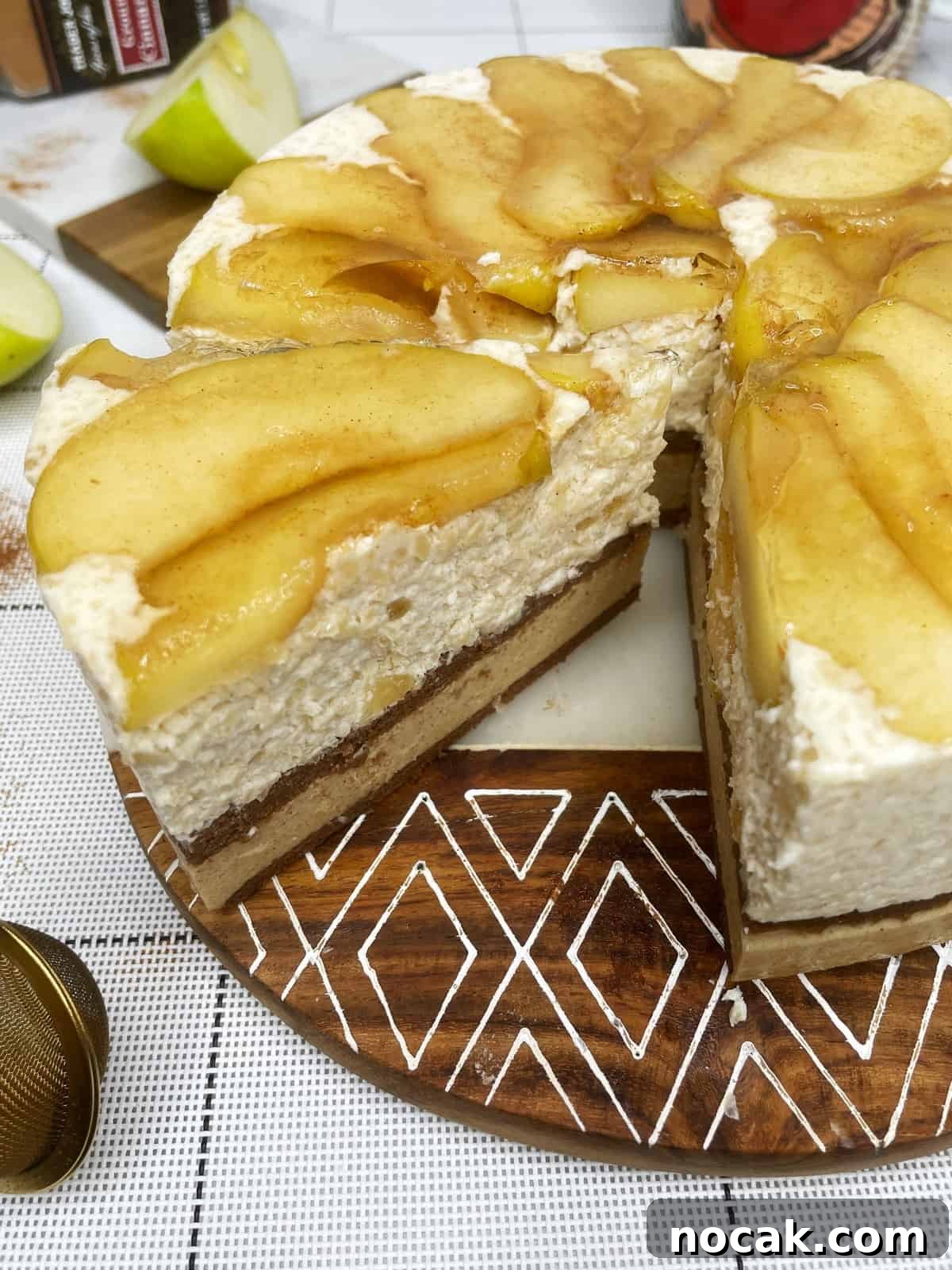 Apple Mousse Cake — Pomme d'Ève Recipe for Light Apple Dessert 3 Sliced apple cake featuring caramelized apples on top of the mousse and a chocolate biscuit