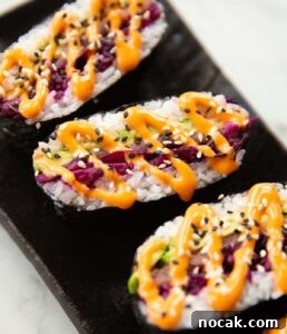 sushi sandwich close up shot of 3 sushi sandwiches on serving plate