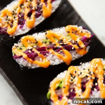 Salmon Onigirazu: Japanese Salmon Sushi Sandwich Recipe 2 close up shot of 3 sushi sandwiches on serving plate