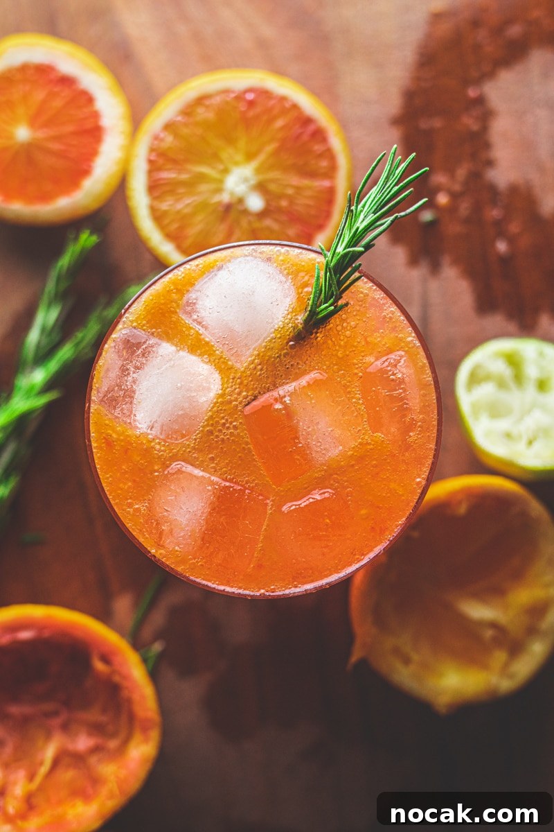 Sparkling Blood Orange Mocktail Recipes for Summer Entertaining 4 Blood orange mocktail with rosemary - Georgie Eats