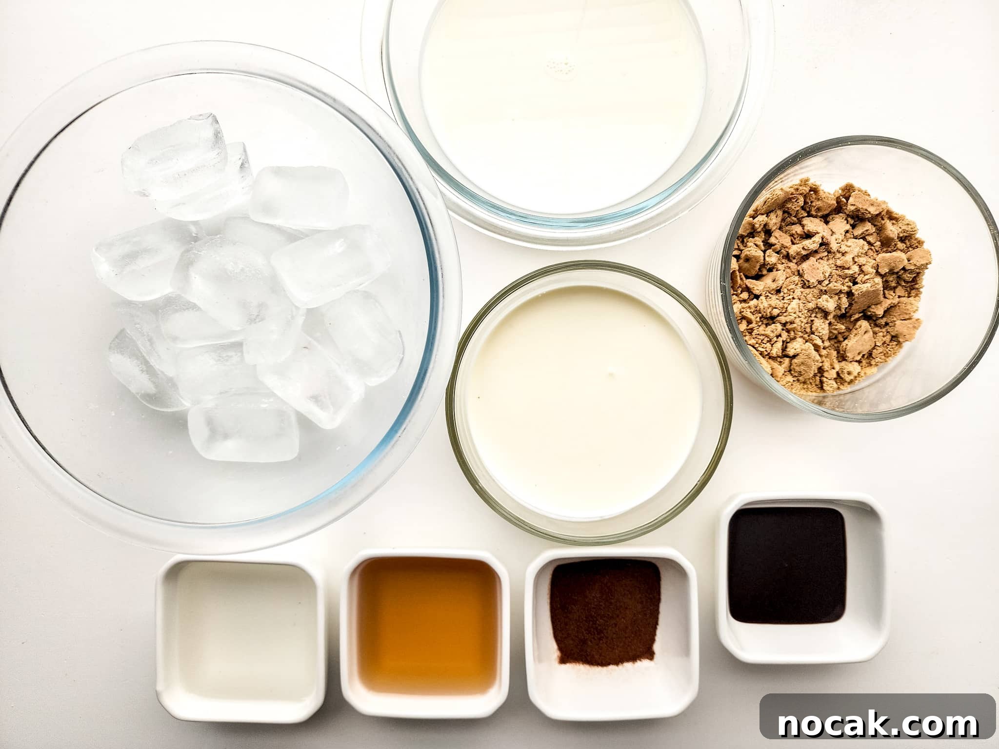 DIY S'mores Frappuccino: Starbucks Copycat Recipe for Home 3 Image of S'mores Frappuccino ingredients separated into white and glass dishes.