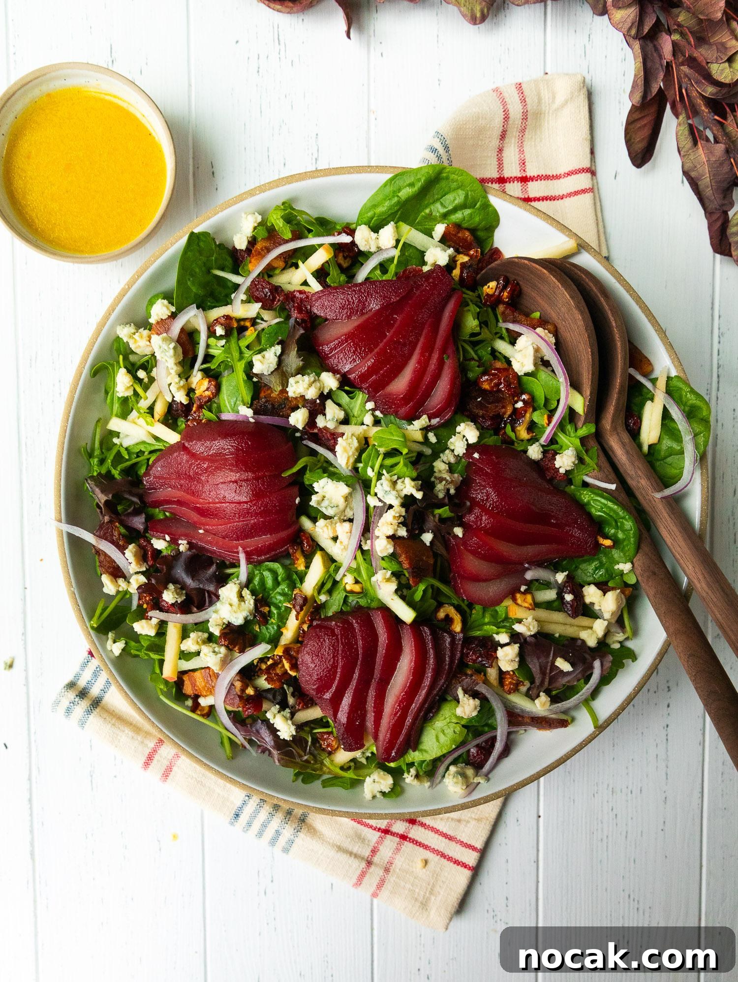 Red Wine-Poached Pear Salad with Blue Cheese, Pancetta & Walnuts 2 Red wine-poached pears with salad