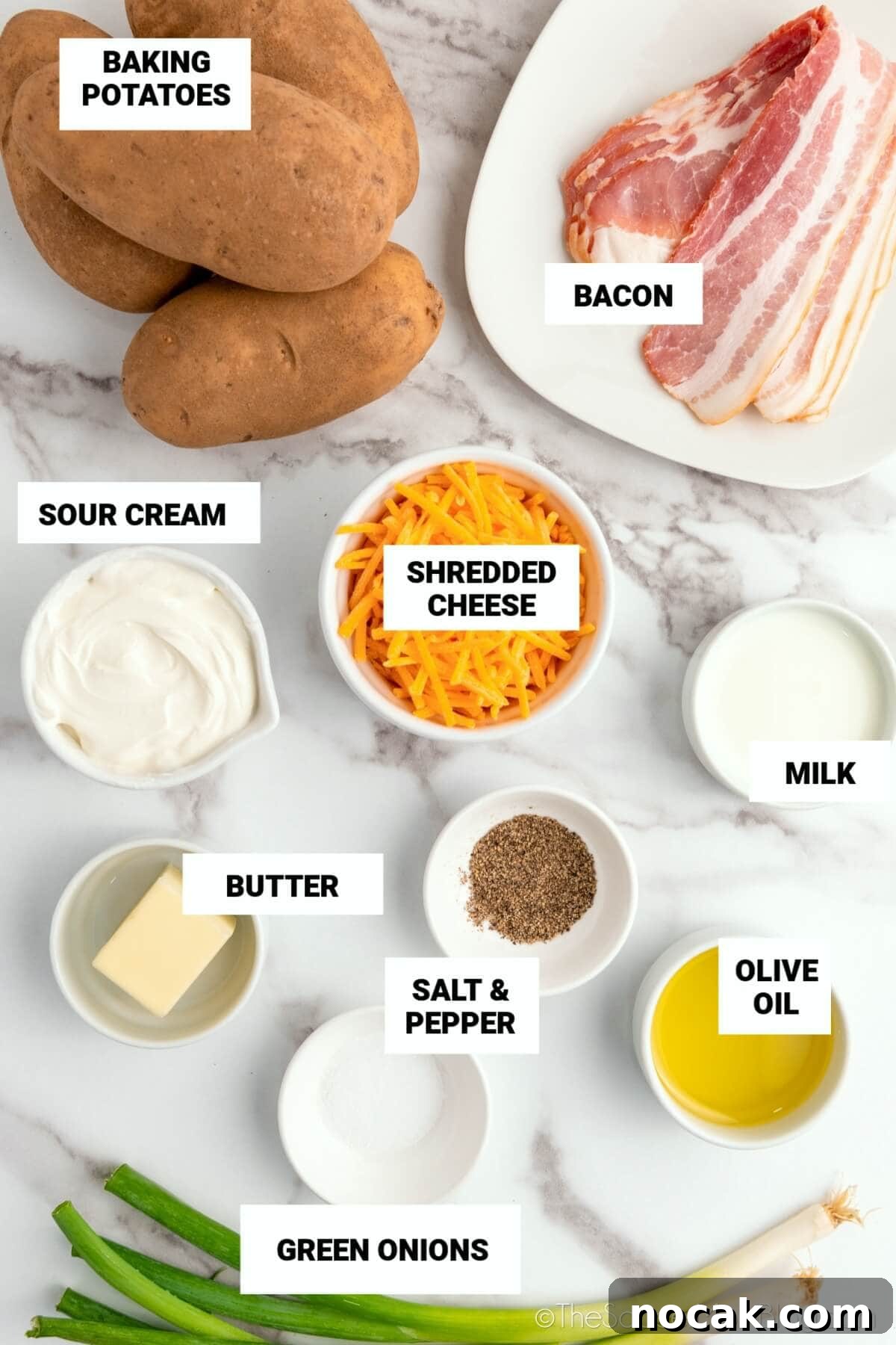 Ultimate Twice-Baked Potatoes Recipe for Crispy, Creamy Filling 4 Twice Baked Potatoes Ingredients: baking potatoes, bacon, sour cream, shredded cheese, milk, butter, salt, pepper, olive oil, and green onions.