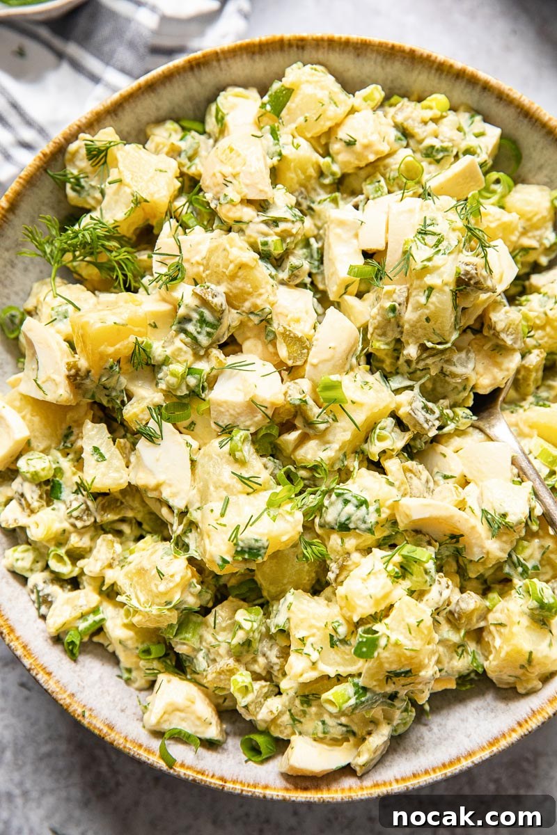Creamy Dill Potato Salad with Fresh Herbs 2 top down view of potato salad with dill and green onions