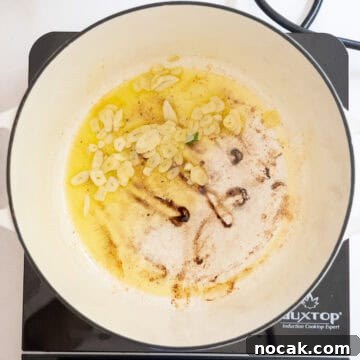 Classic Italian Fried Meatballs Recipe — Crispy, Savory Plates 8 Garlic sauteing in olive oil.